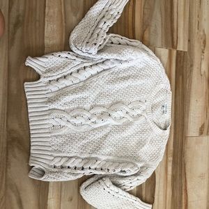 white knitted looking sweater